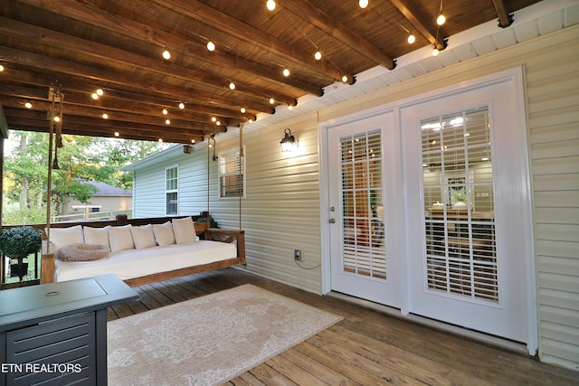 unfurnished sunroom with wood ceiling and beam ceiling