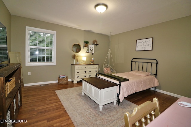 bedroom featuring dark hardwood / wood-style floors