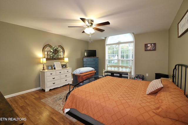 bedroom featuring ceiling fan and wood-type flooring