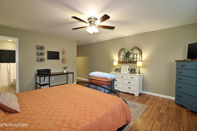 bedroom with light hardwood / wood-style floors and ceiling fan