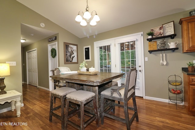 dining space featuring a notable chandelier, lofted ceiling, and dark wood-type flooring