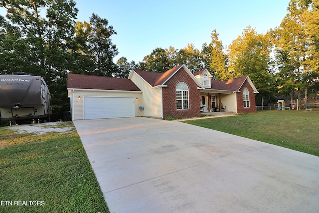 view of front facade with a garage and a front yard