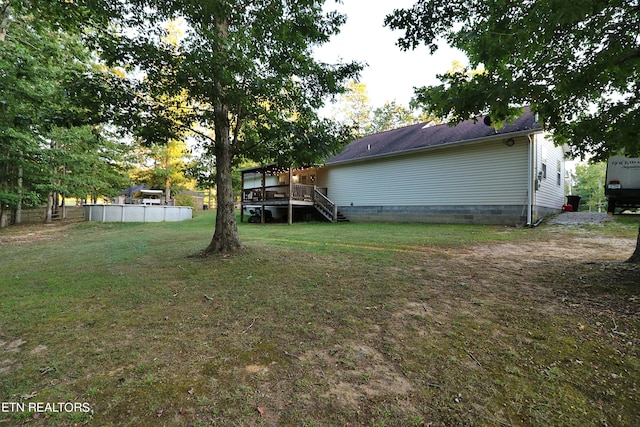 view of yard featuring a wooden deck