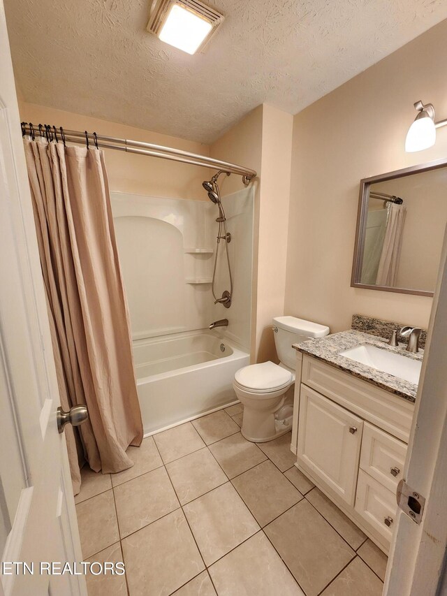 5725 Academy Dr, Morristown, TN 37814 - full bathroom featuring vanity, a textured ceiling, tile patterned flooring, shower / tub combo with curtain, and toilet