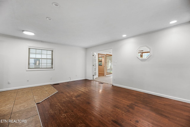 empty room with wood-type flooring