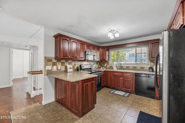 kitchen with ornamental molding, light wood-type flooring, black appliances, and decorative backsplash