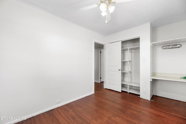 unfurnished bedroom featuring a closet, ceiling fan, and dark hardwood / wood-style flooring