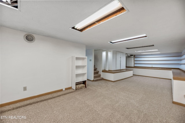 basement featuring carpet flooring