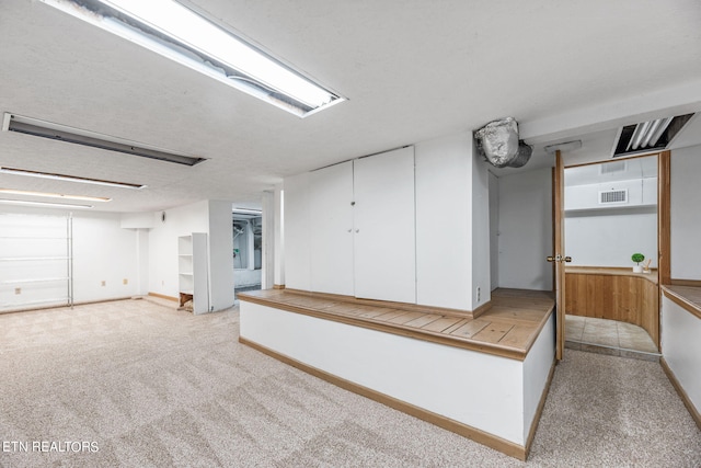 basement with light carpet