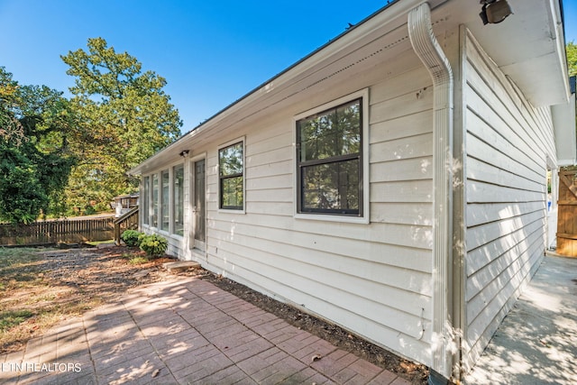 view of side of property with a patio