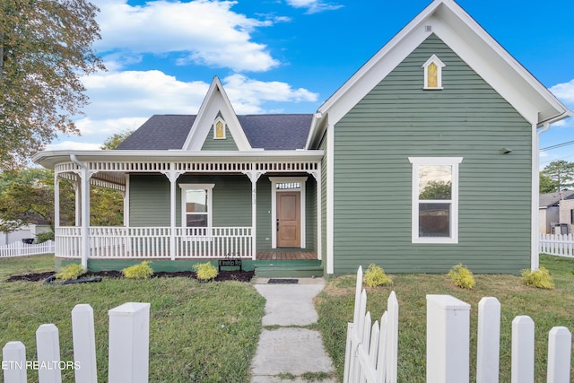 view of front of home with a front lawn and covered porch