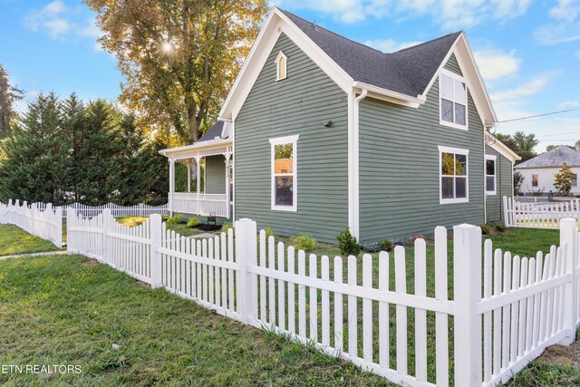 view of side of home featuring a lawn