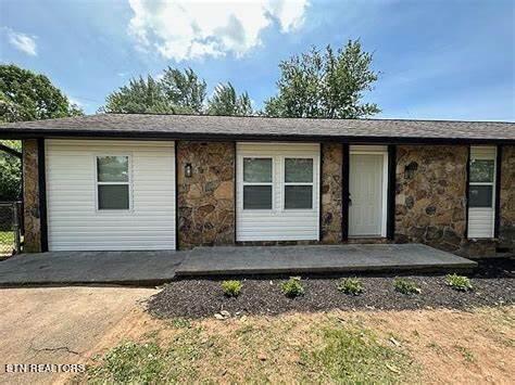 single story home featuring a patio area