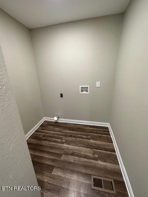 laundry room with washer hookup, hookup for an electric dryer, and dark hardwood / wood-style flooring