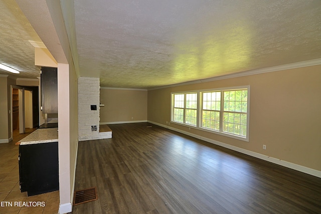 unfurnished living room with a textured ceiling, crown molding, and dark hardwood / wood-style flooring