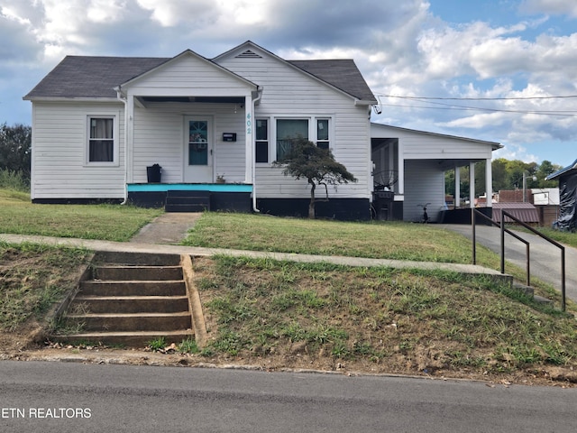 view of front of house featuring covered porch and a front yard