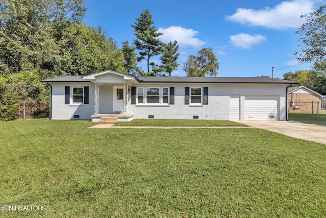 ranch-style home featuring a garage and a front lawn