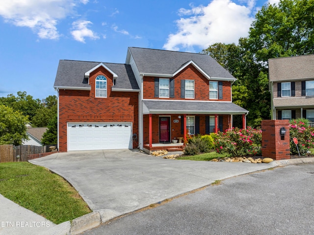 view of front of house featuring a garage and covered porch