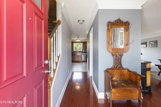 entrance foyer featuring ornamental molding and dark wood-type flooring