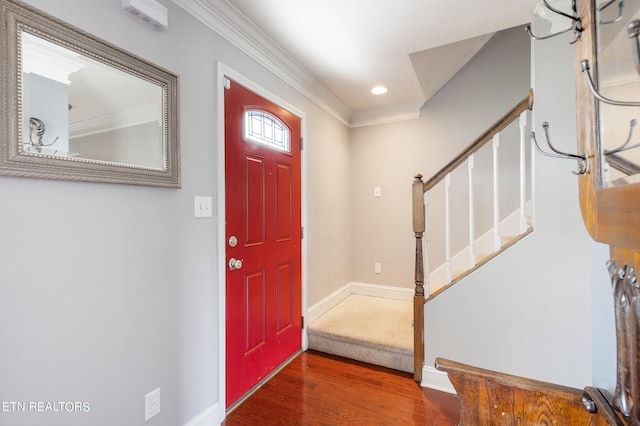 entrance foyer featuring dark hardwood / wood-style floors and ornamental molding