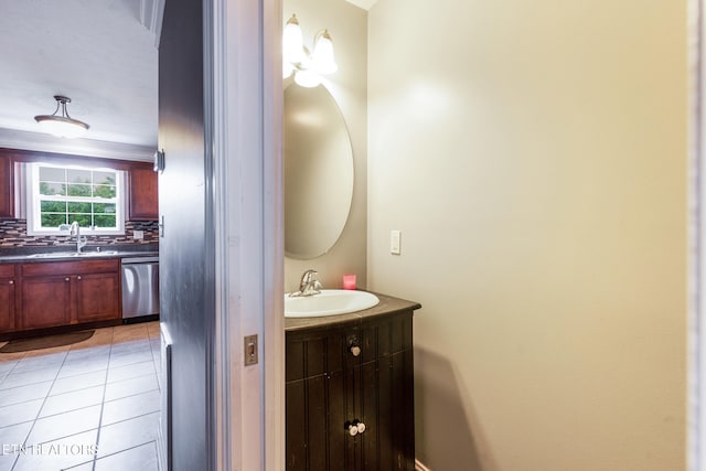 bathroom with backsplash, tile patterned flooring, and vanity