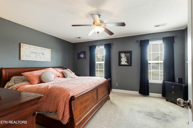 bedroom with light carpet and ceiling fan