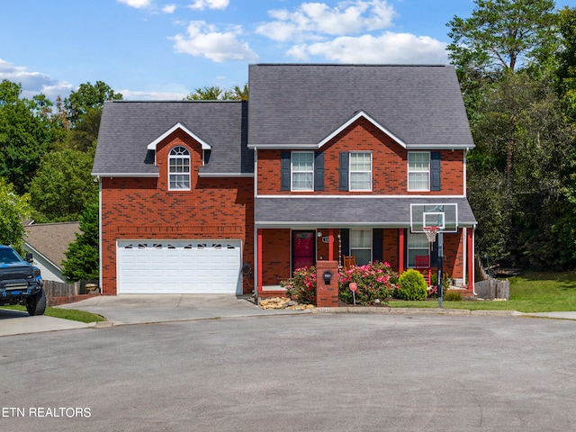 view of front of house featuring a garage and covered porch