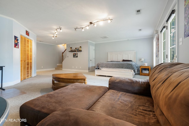 bedroom with carpet floors and ornamental molding