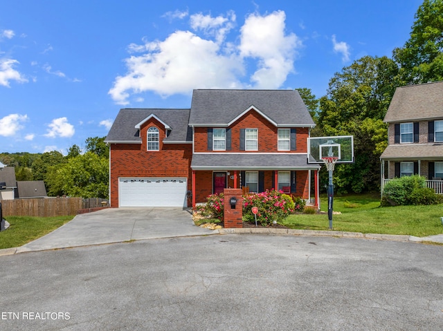 view of front of property with a garage and a front yard