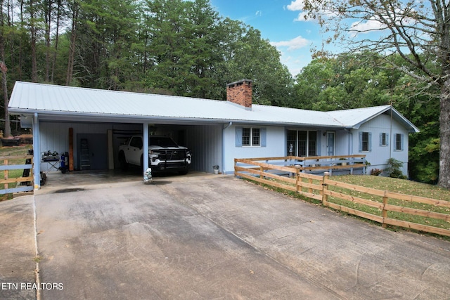 single story home featuring a carport