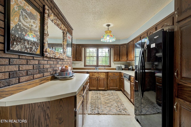 kitchen featuring sink, black fridge with ice dispenser, a textured ceiling, and stainless steel dishwasher