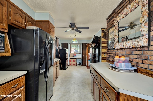 kitchen featuring black fridge with ice dispenser, a textured ceiling, ceiling fan, decorative light fixtures, and black fridge