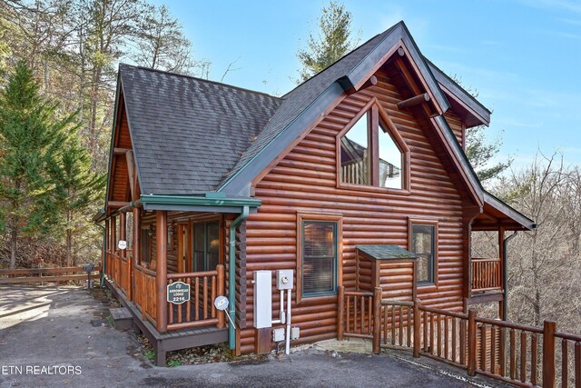 cabin featuring covered porch