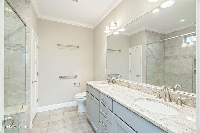 bathroom with tile patterned floors, an enclosed shower, vanity, crown molding, and toilet