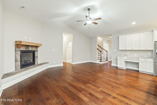 unfurnished living room featuring ceiling fan, lofted ceiling, and dark hardwood / wood-style flooring