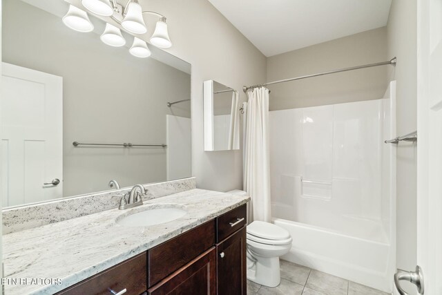 full bathroom with toilet, vanity, tile patterned floors, and shower / bath combo with shower curtain