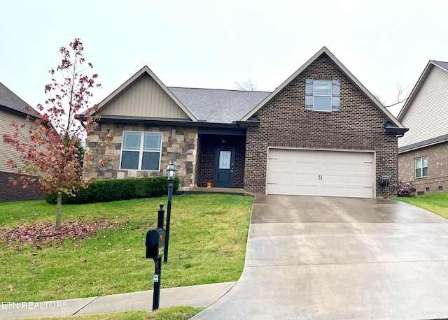 view of front of property featuring a front yard and a garage