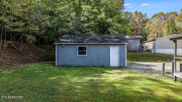 view of outdoor structure with a lawn