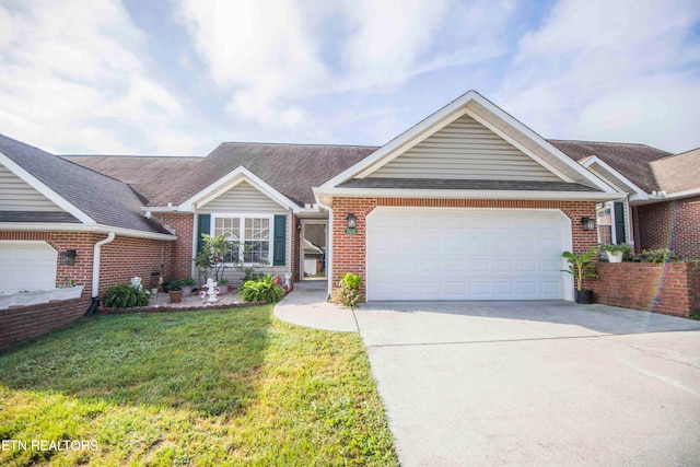 ranch-style home with a garage and a front lawn