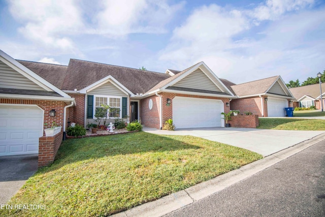 ranch-style home with a garage and a front lawn