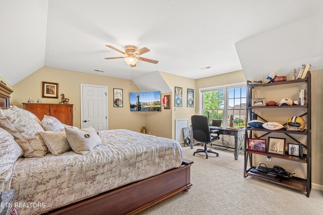 carpeted bedroom with lofted ceiling and ceiling fan