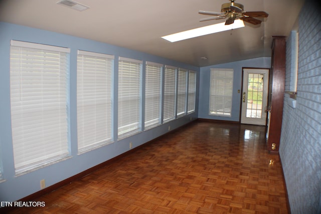 unfurnished sunroom featuring visible vents and a skylight