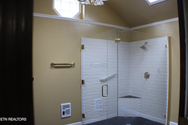 bathroom featuring heating unit, a notable chandelier, a stall shower, and vaulted ceiling