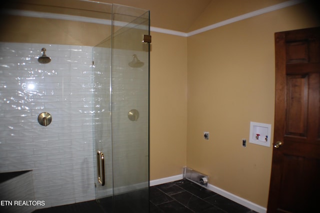 interior space featuring baseboards, lofted ceiling, a stall shower, and crown molding