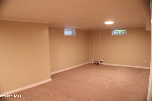 basement featuring carpet floors, baseboards, and recessed lighting