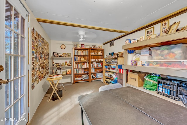 interior space featuring concrete flooring and ceiling fan