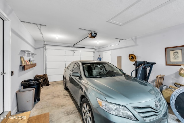 garage featuring a garage door opener and electric panel