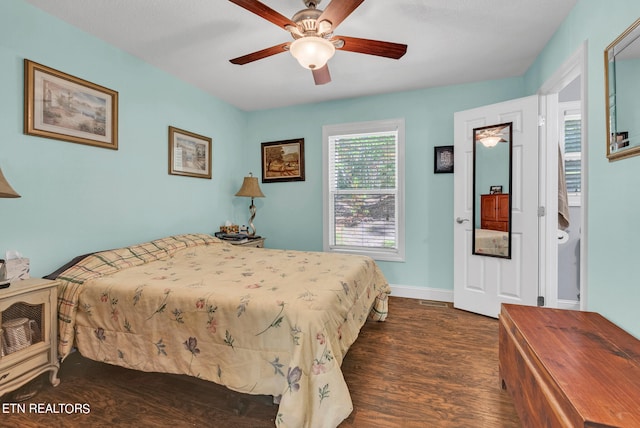 bedroom with dark hardwood / wood-style floors and ceiling fan