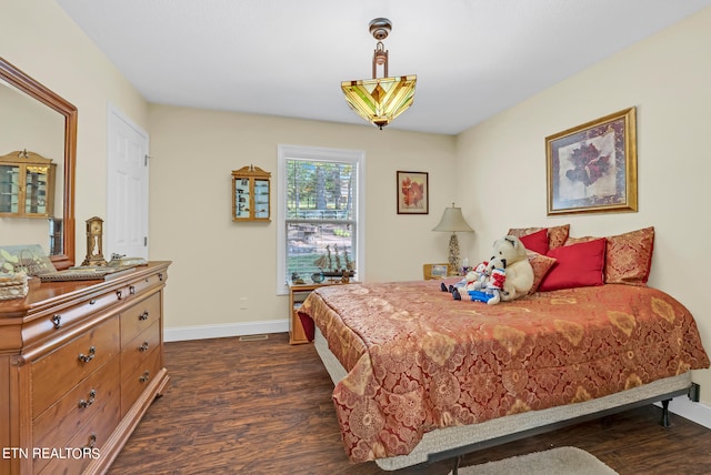 bedroom featuring dark hardwood / wood-style floors