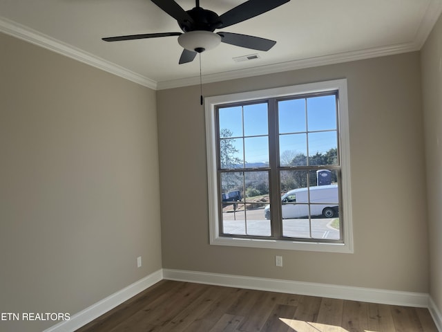 empty room with dark hardwood / wood-style floors, ceiling fan, and crown molding